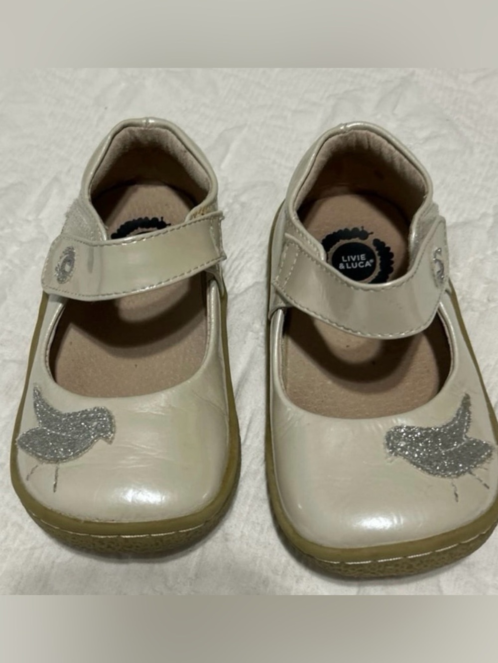 Livie & Luca Cream/Tan Mary Jane Shoes with Silver Glitter Bird, Size 7.